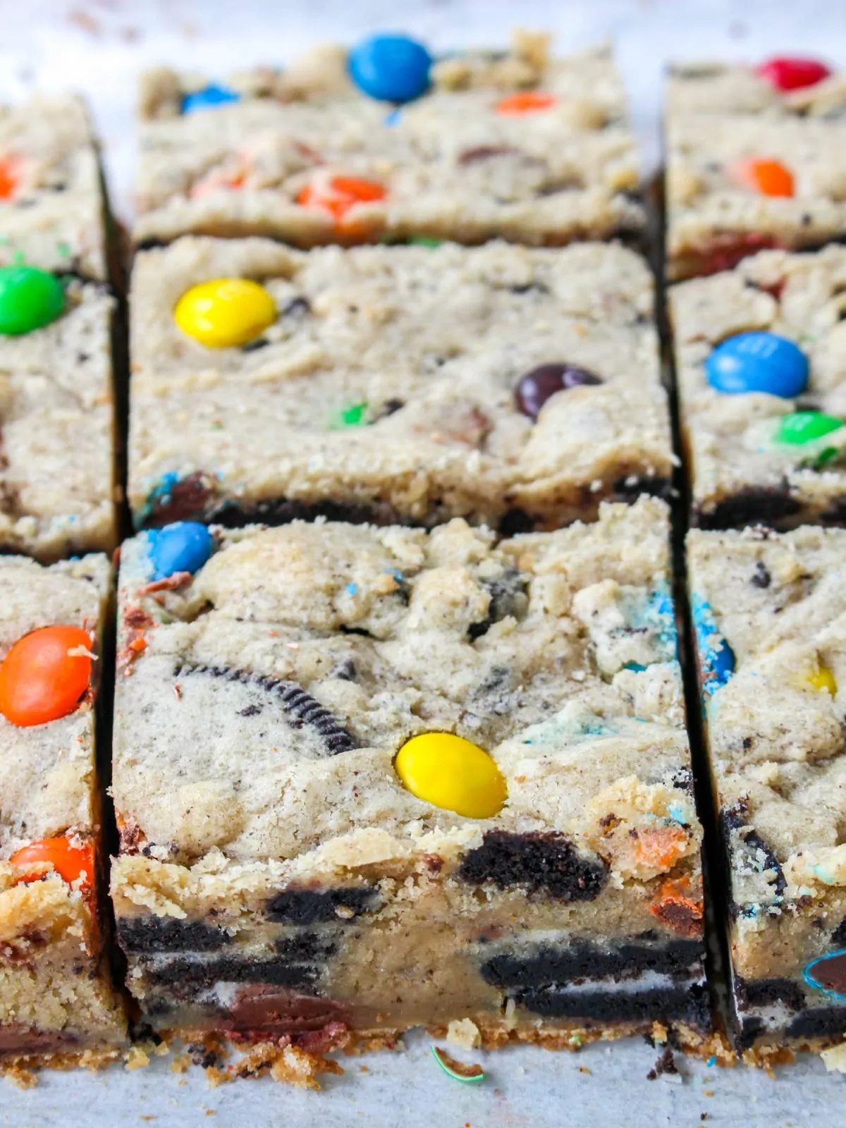 sliced cookie bars loaded with M&M's, Oreos, and peanut butter cups