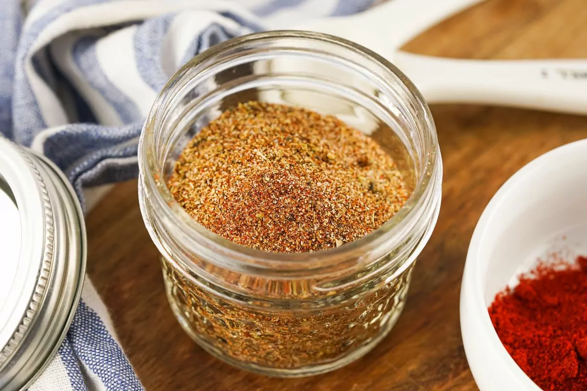 small mason jar filled with taco seasoning blend.