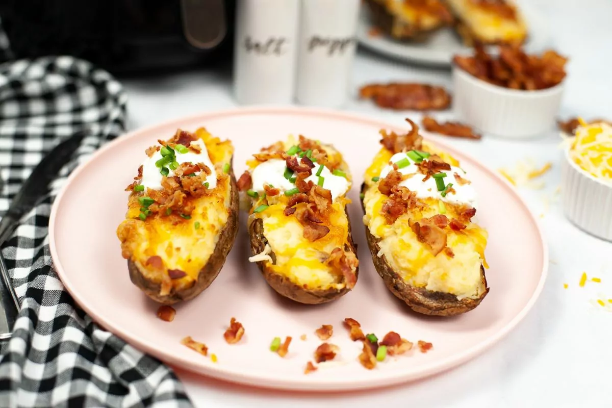 3 twice baked potatoes on plate.