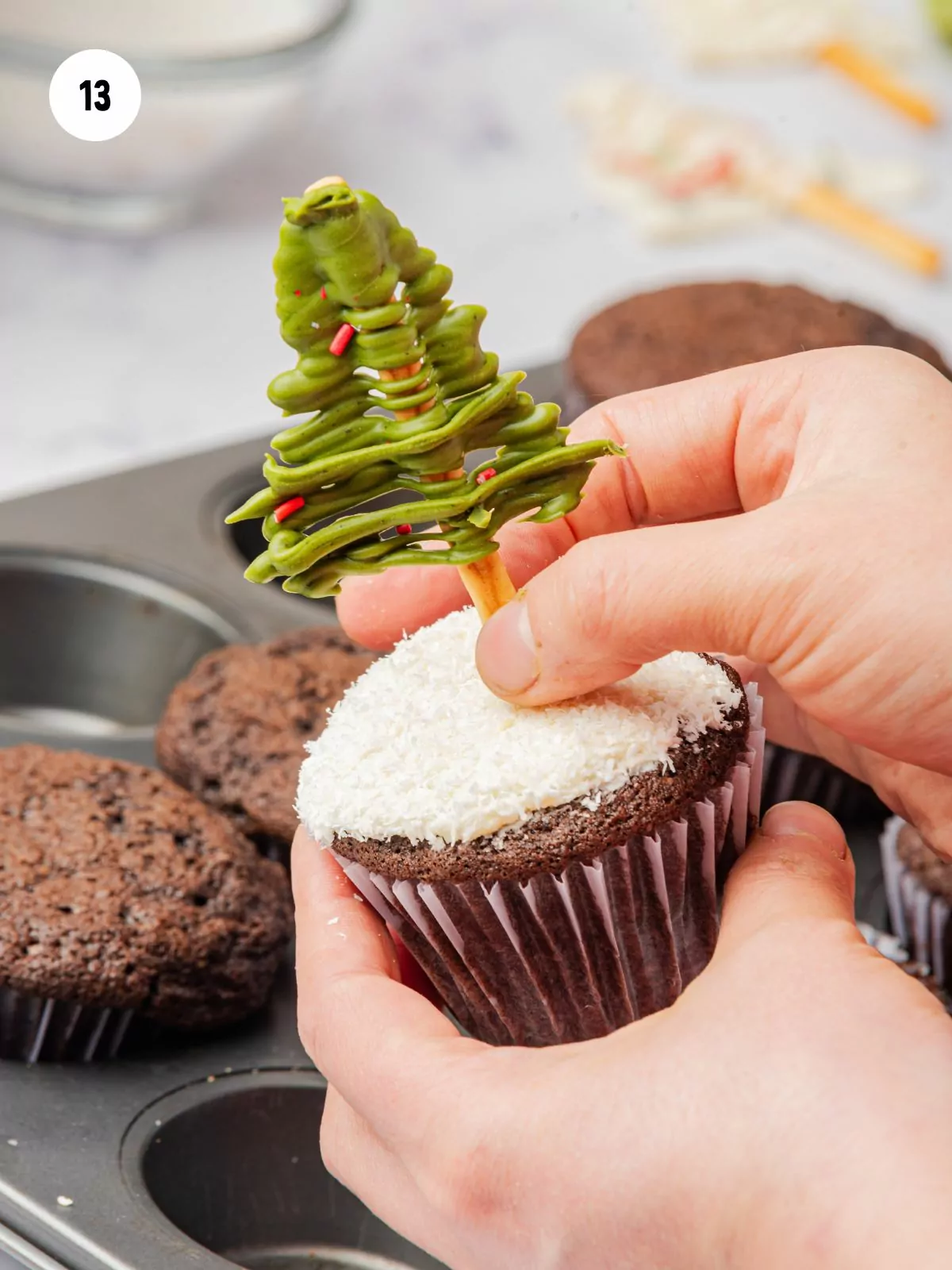 chocolate tree toppers placed into cupcakes