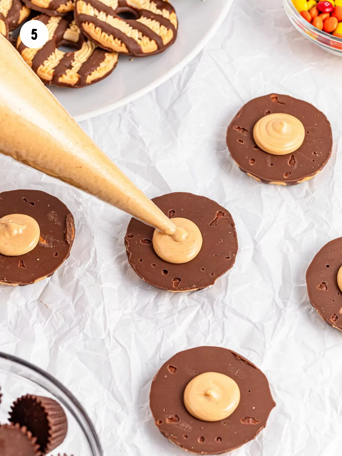 Peanut butter white chocolate piped into the center of the cookies