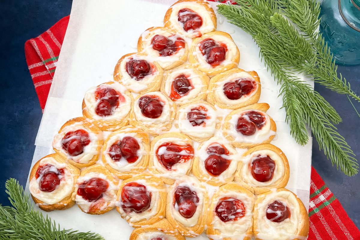 crescents with cherry pie filling and cream cheese in the shaped of a Christmas tree.