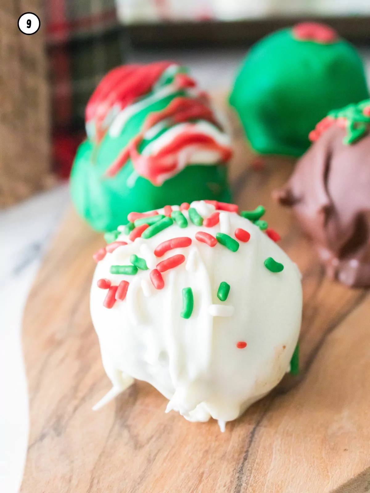 Close up of white chocolate cookie balls with Christmas sprinkles.