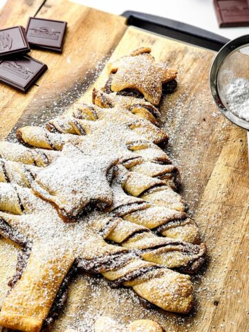 Christmas tree pastry on cutting board.