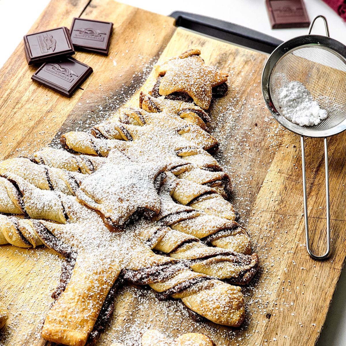 Christmas tree pastry on cutting board.