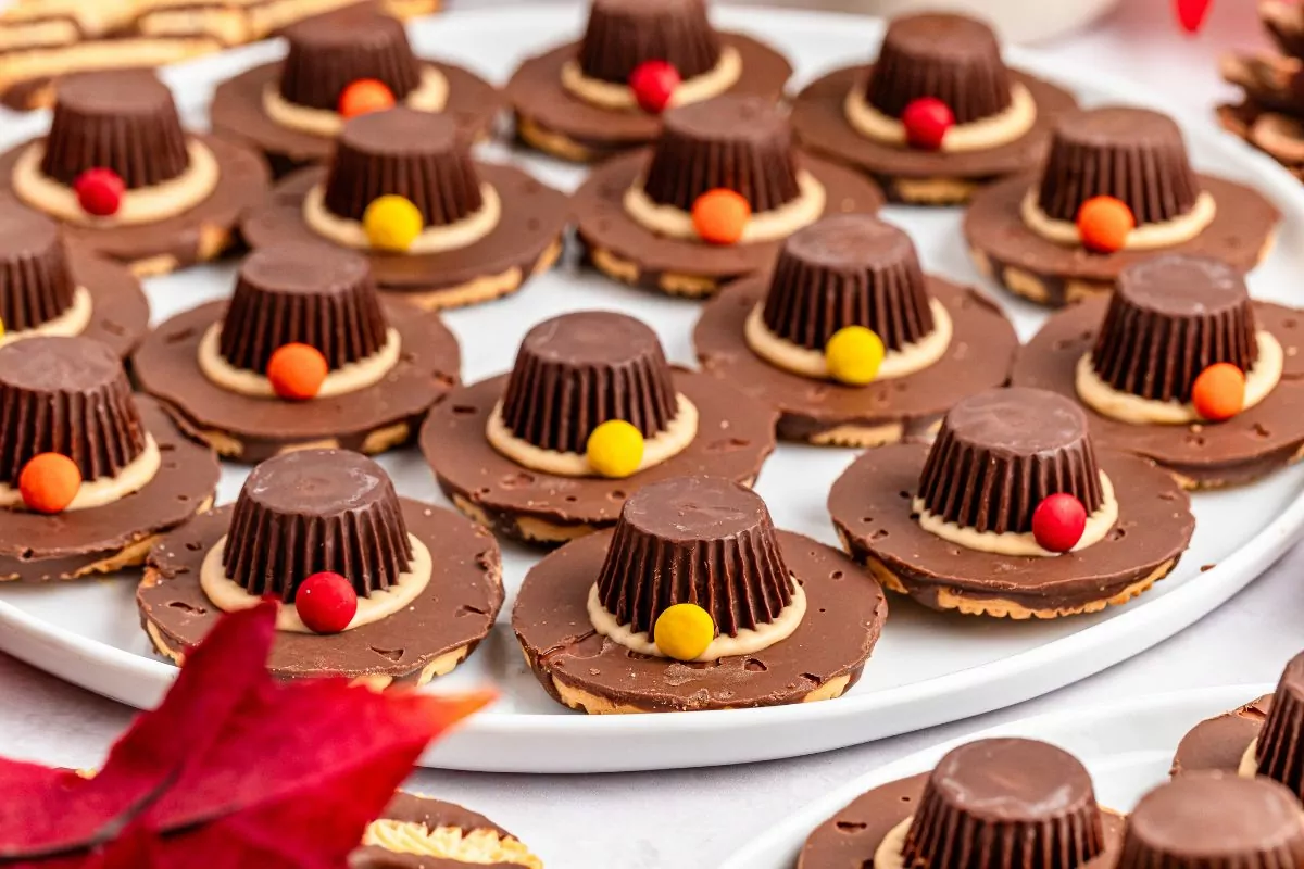 white platter filled with pilgrim hat cookies