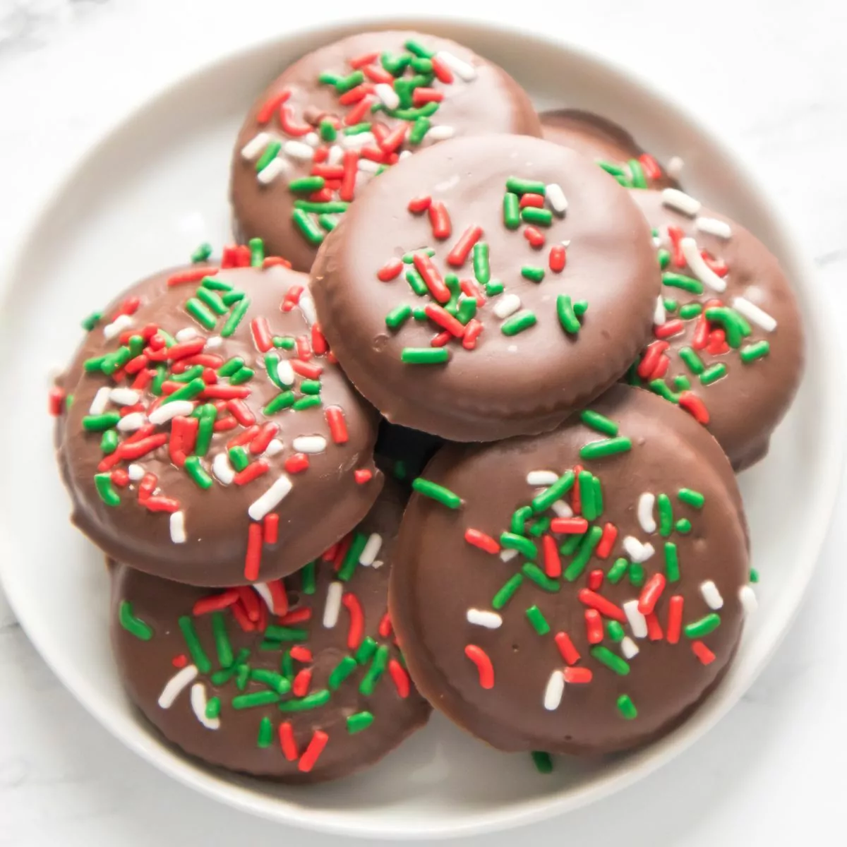 top view of chocolate mint no bake cookies with Christmas sprinkles