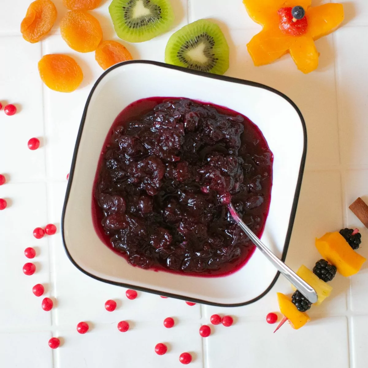 cranberry sauce with spoon in bowl.