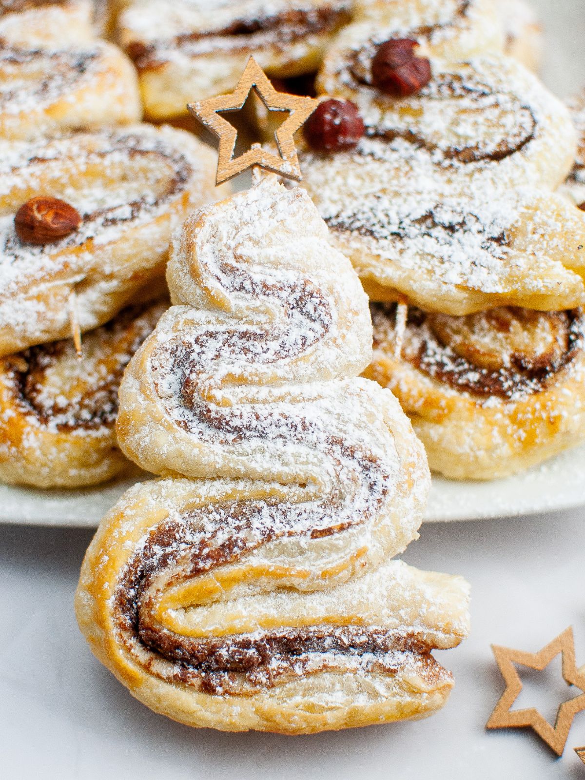 close up of Nutella puff pastry in the shape of a tree on a star stick