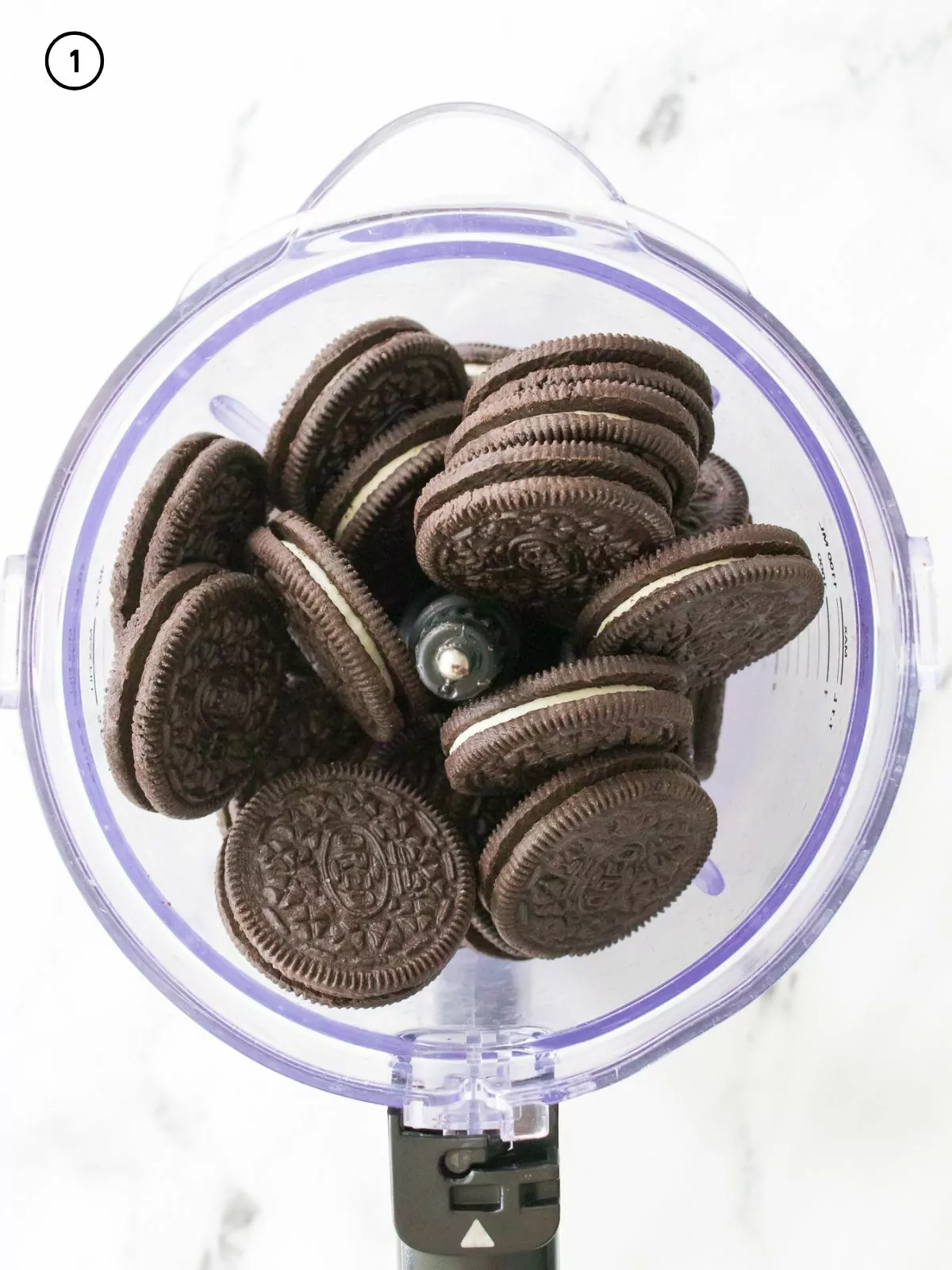 Oreo sandwich cookies in food processor.