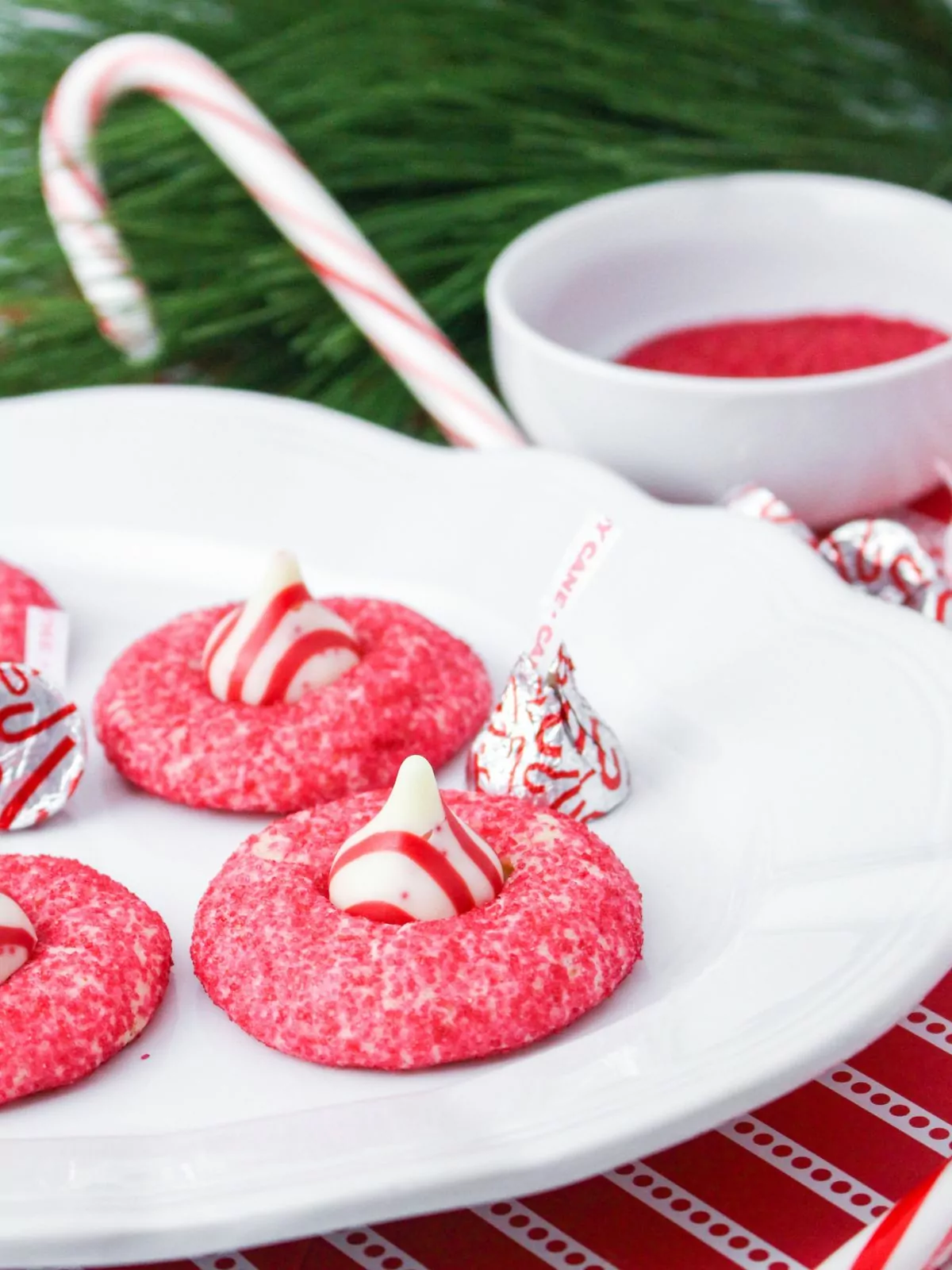 peppermint cookies with candy kisses on white plate.