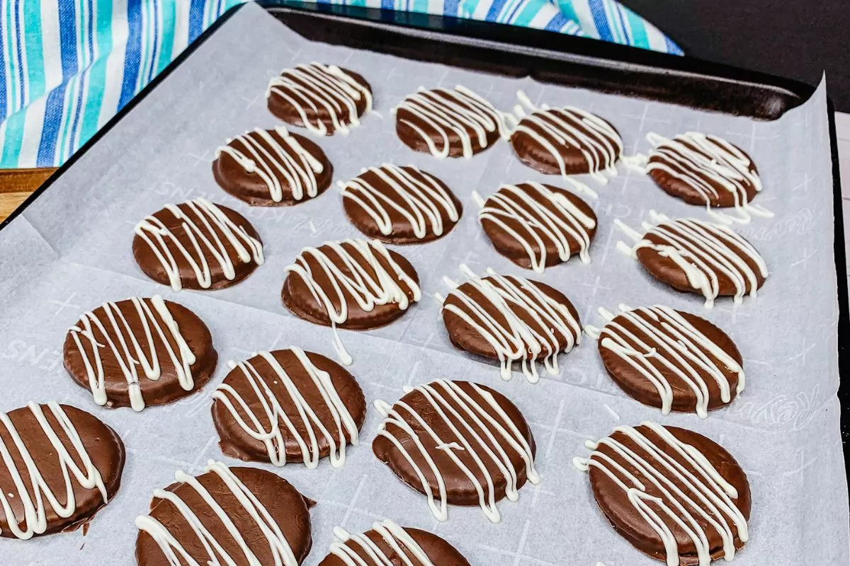 chocolate thin mint cookies with white chocolate drizzle.