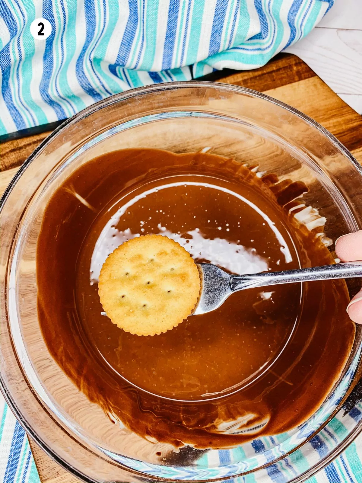 dip cracker in melted chocolate.