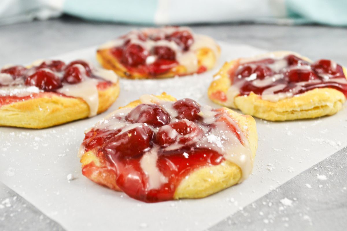 4 crescent rolls with cherry pie filling.