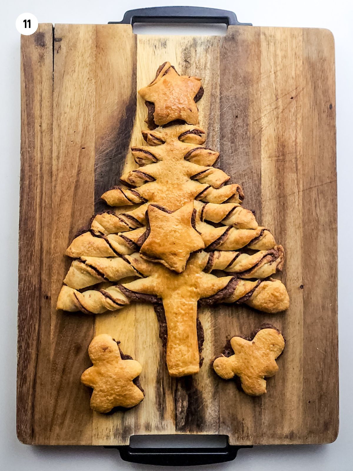baked Christmas tree pastry on cutting board.
