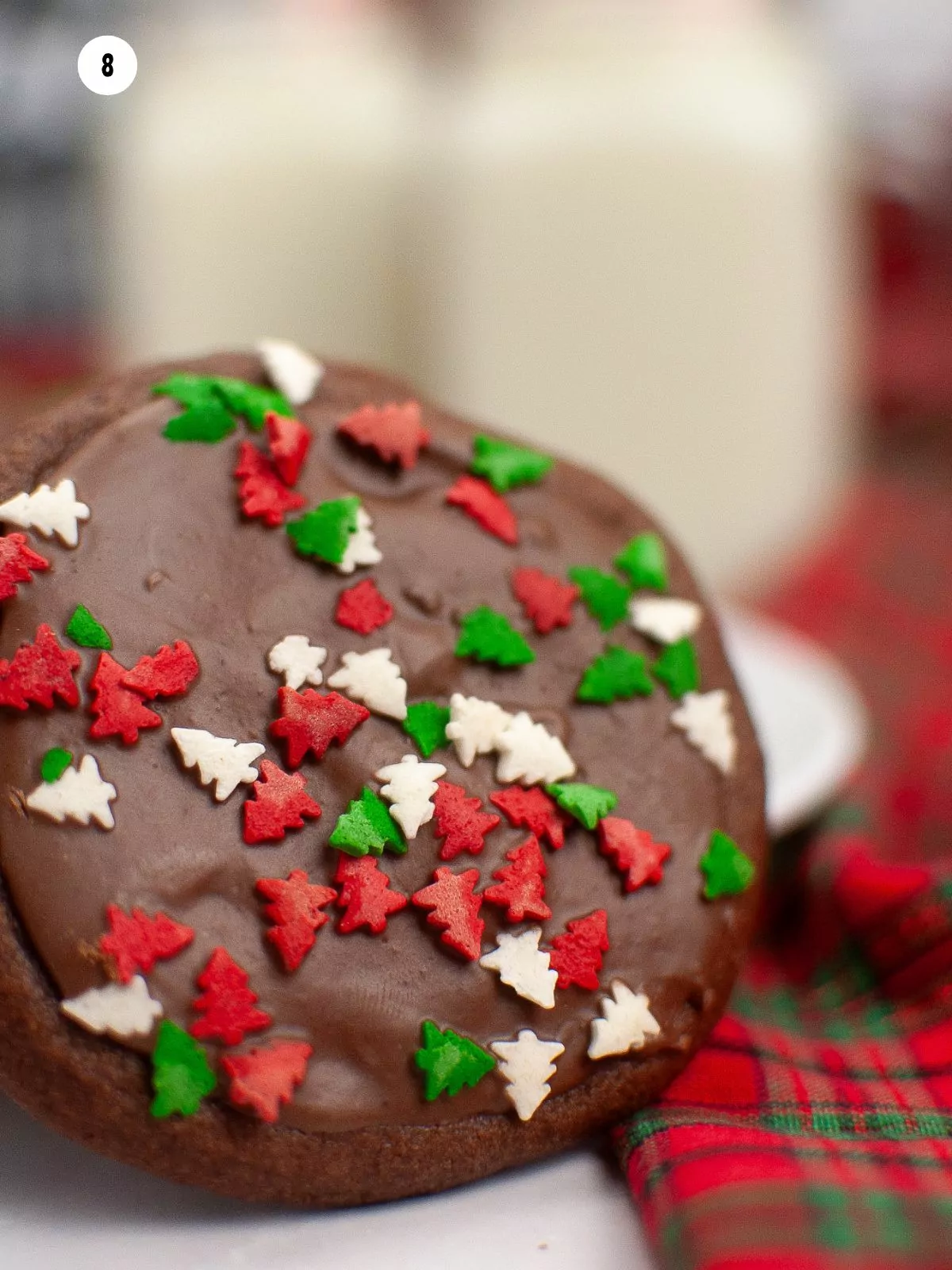 closeup of decorated cookies with Christmas tree sprinkles.