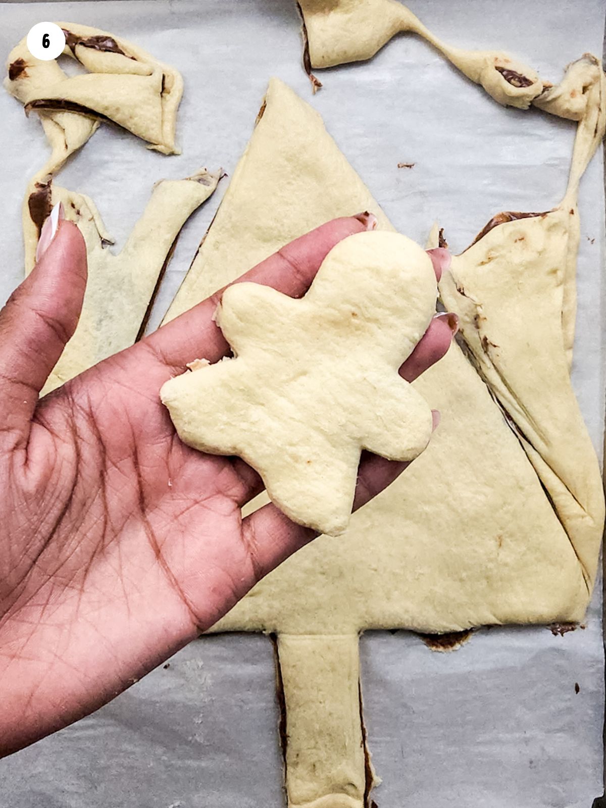 crescent rolls sheet dough gingerbread man with Nutella.