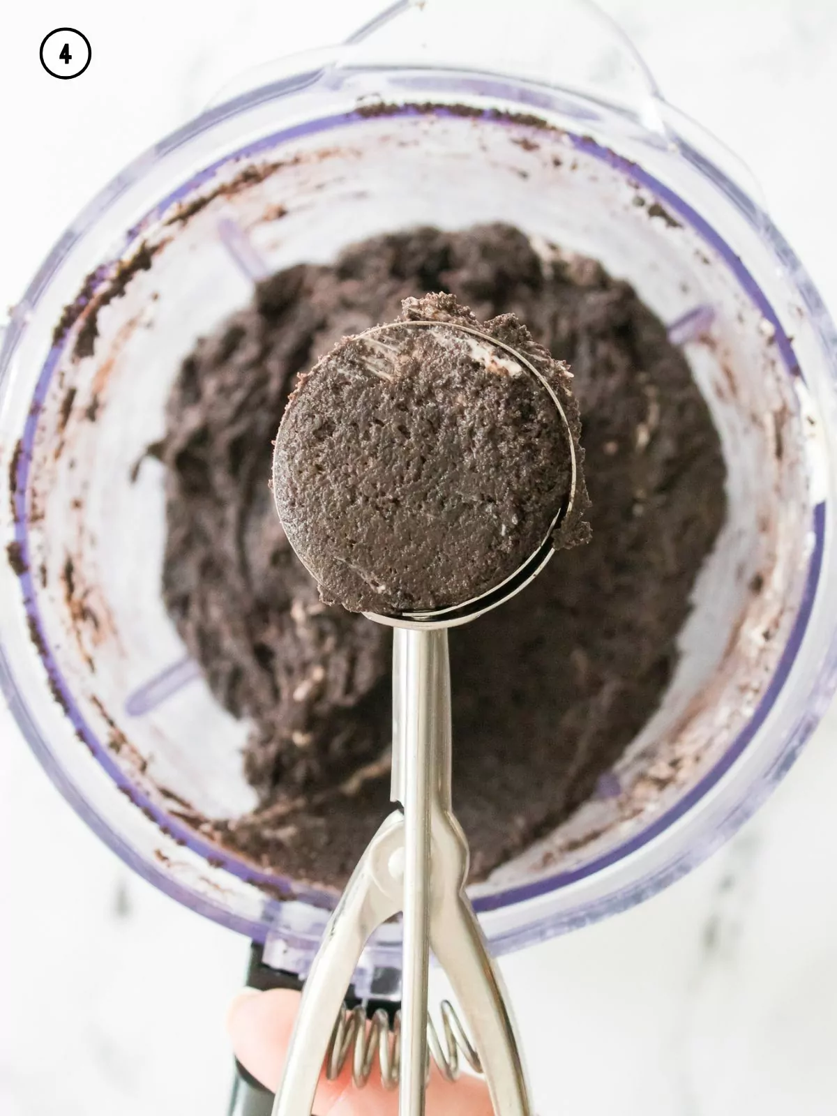 cookie scoop filled with chocolate cookie crumb mixture.