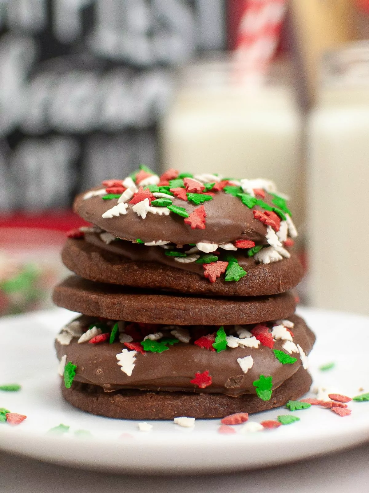 stacked Christmas cookies with sprinkles.