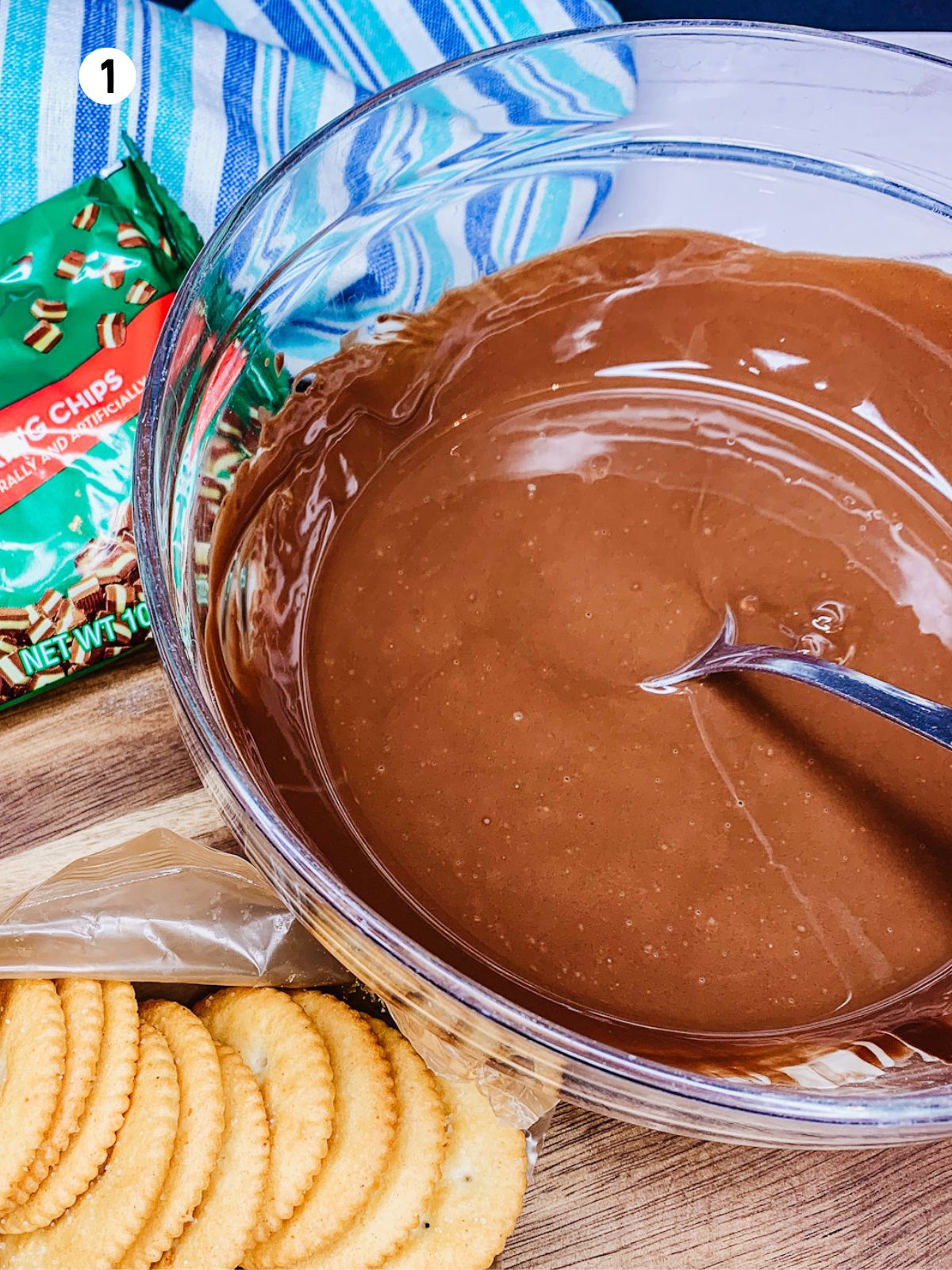 melted chocolate in bowl with ritz crackers.