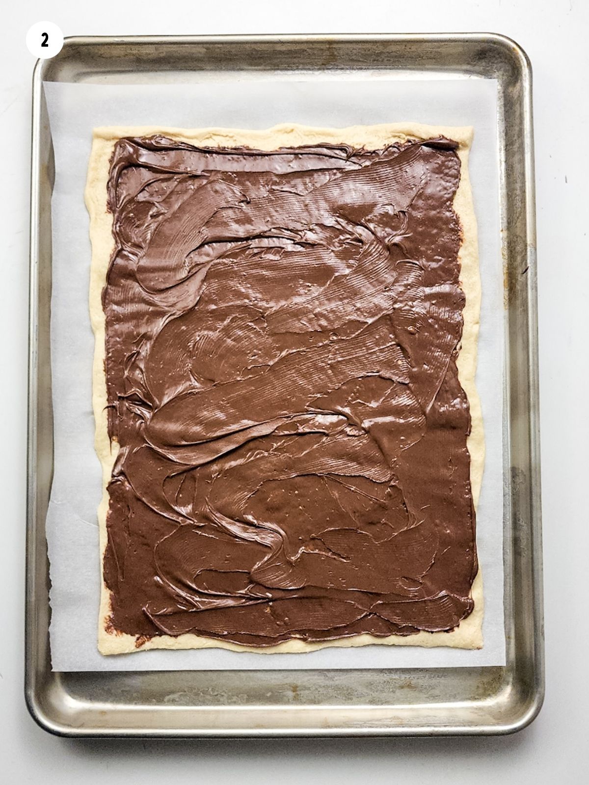 Hazelnut spread on top of crescent rolls.