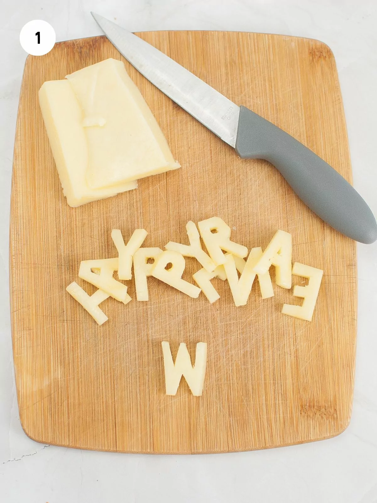 letters cut out of cheese