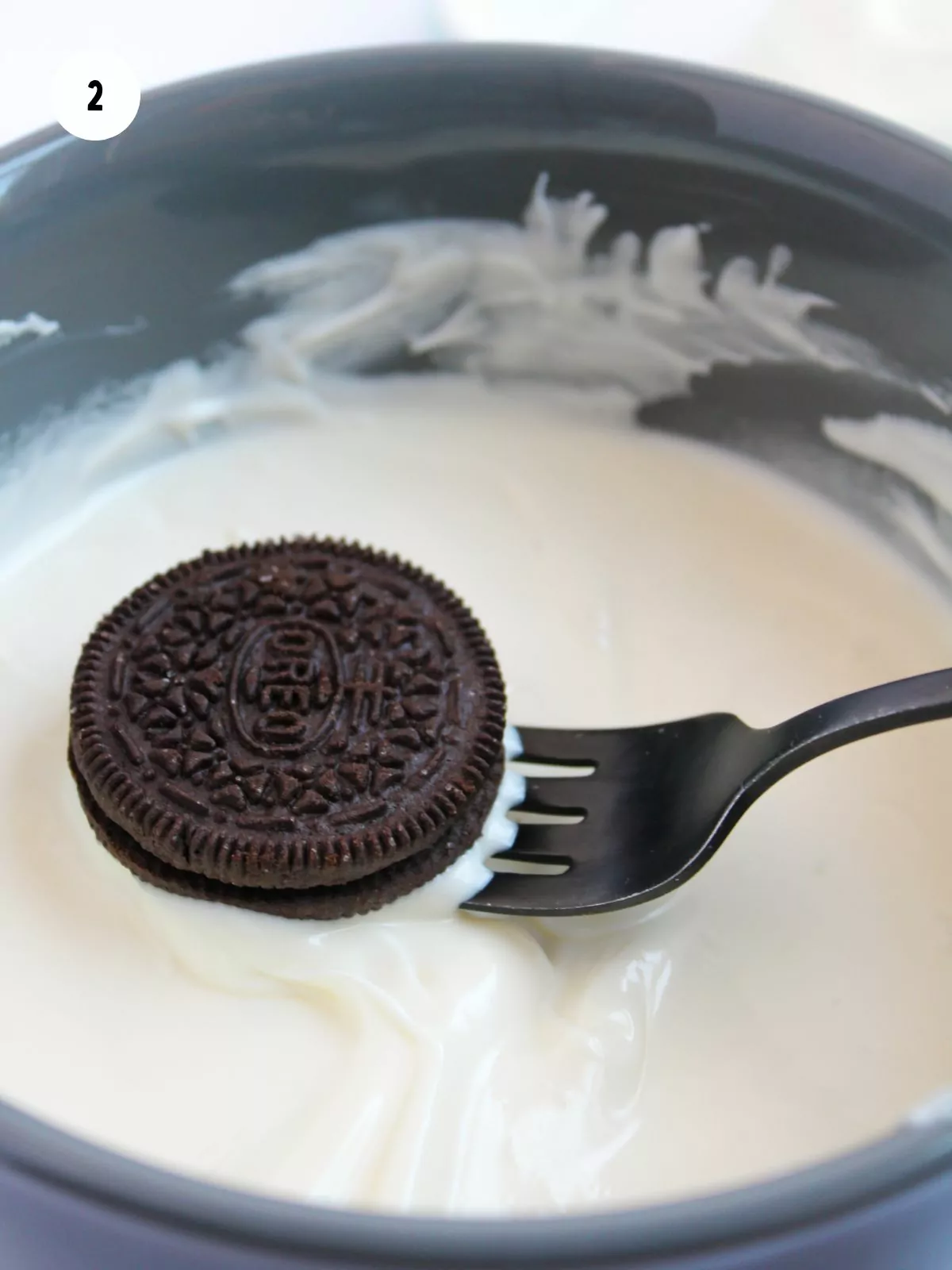 oreo dipped in white chocolate with fork