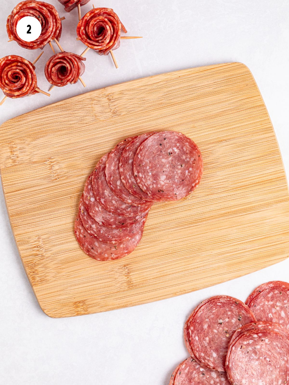 salami overlapping on a cutting board