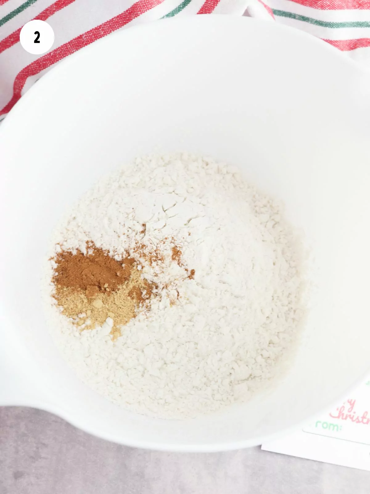 mixing bowl of flour with ginger and cinnamon added