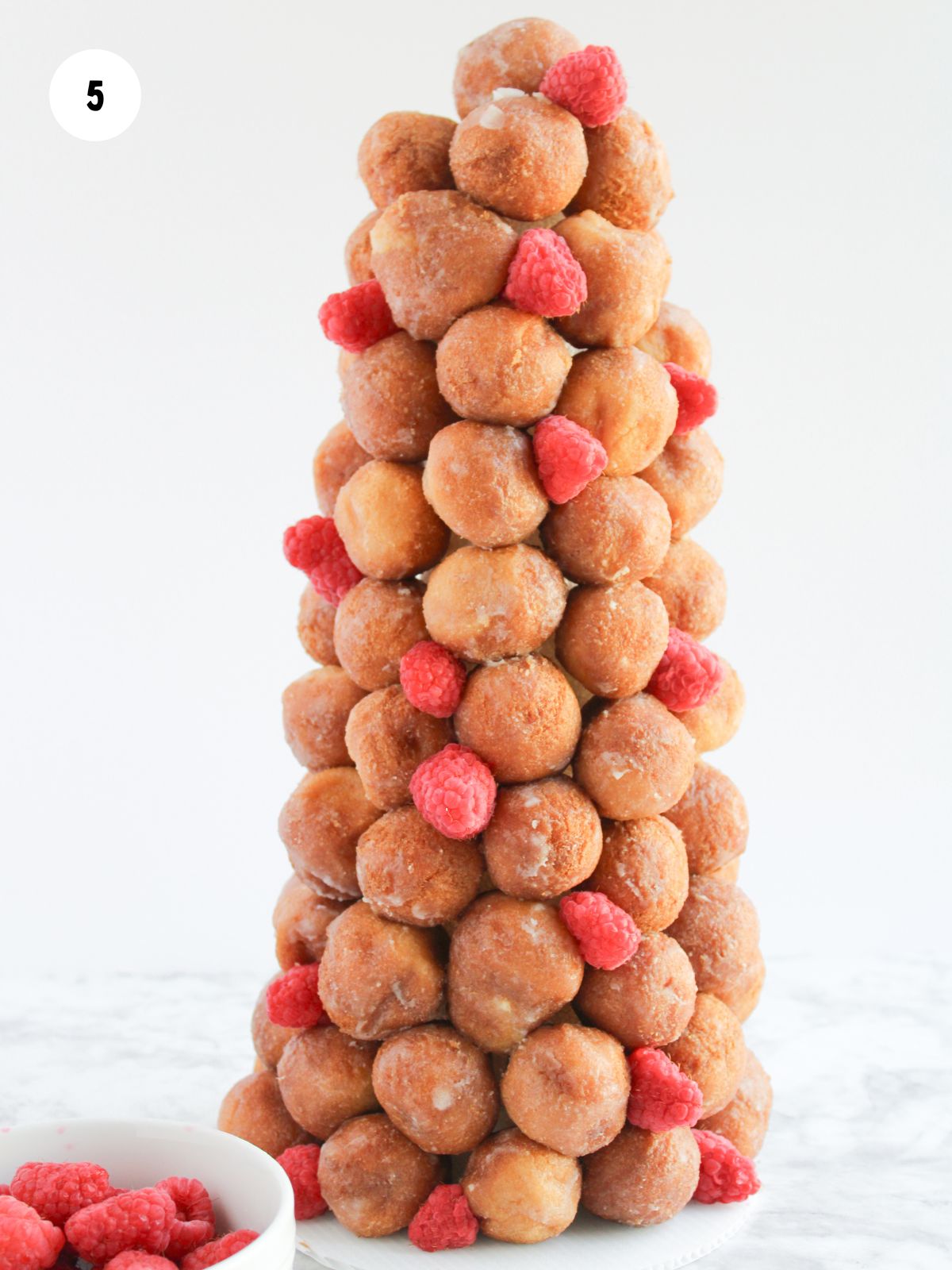 raspberries added in gaps of donut holes