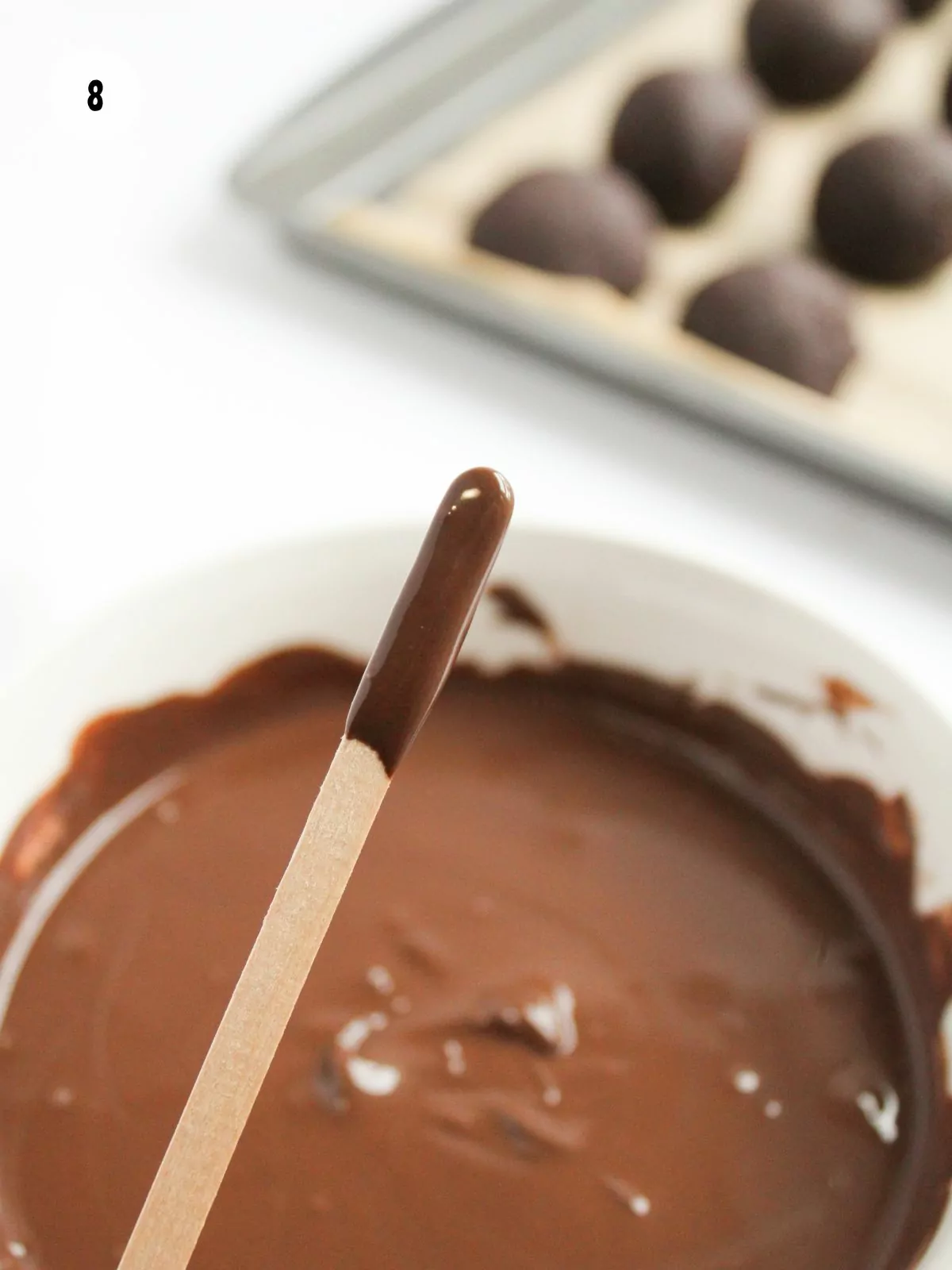 stick dipped into melted chocolate