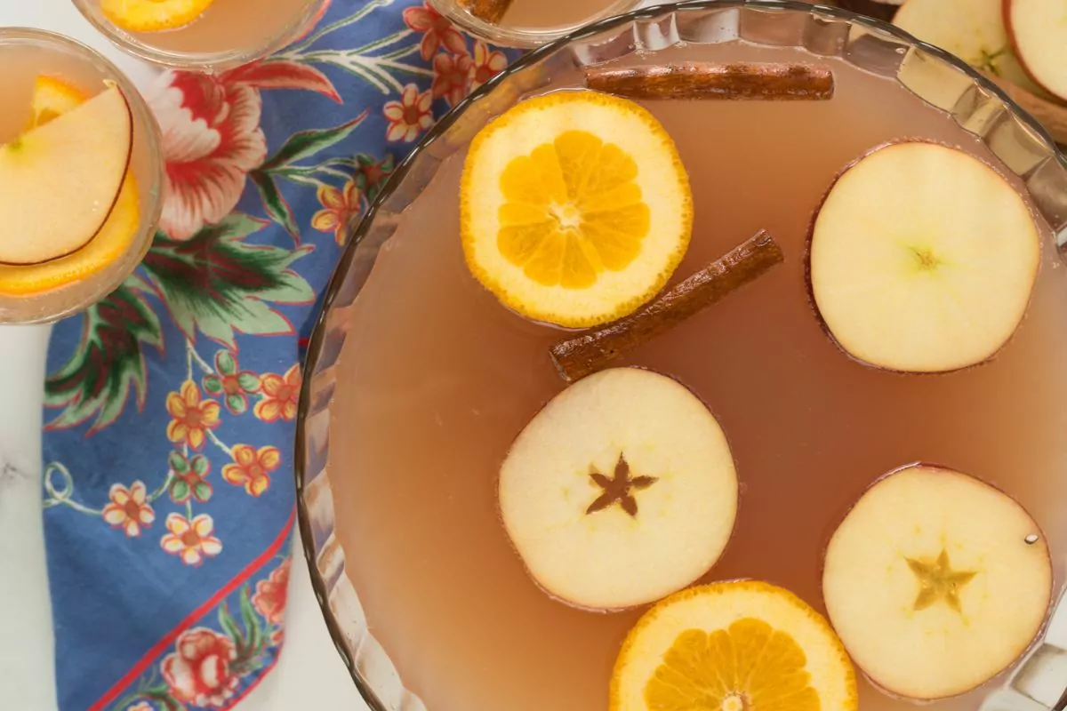 punch bowl with beverage and fruit slices. MSN.