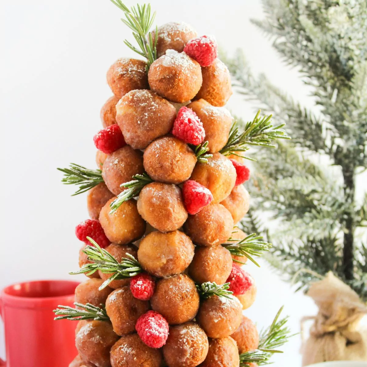 Donut Christmas Tree with raspberries and rosemary sprigs