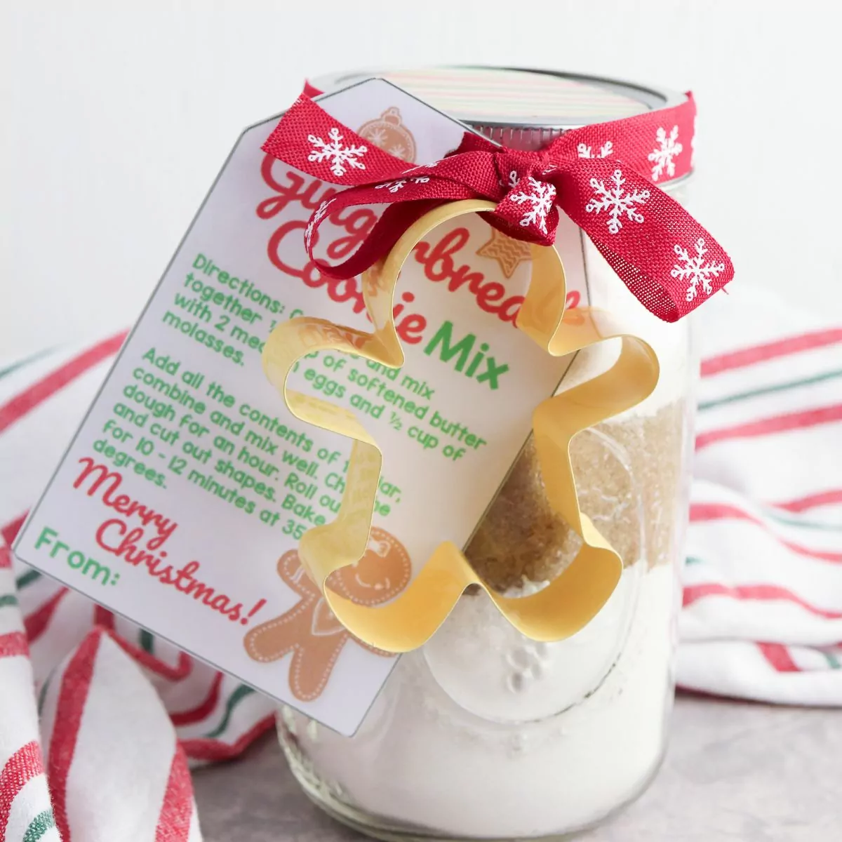 Gingerbread Cookie Mix in a Jar with a gingerbread man cookie cutter