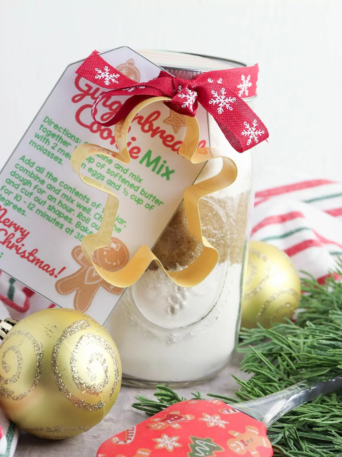 Gingerbread Cookie Mix in a Jar with a recipe tag and cookie cutter attached