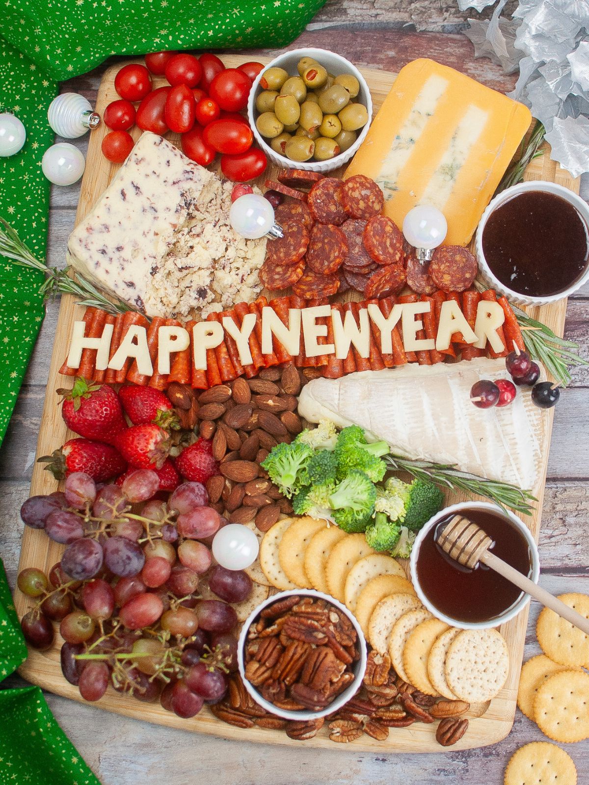 New Year’s Eve Charcuterie Board filled with meats, cheeses, fruits, veggies, and nuts