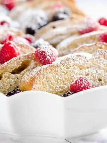 French Toast with fresh berries in white casserole dish MSN.