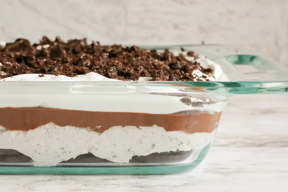 no bake Oreo pudding dessert side view in a casserole dish.