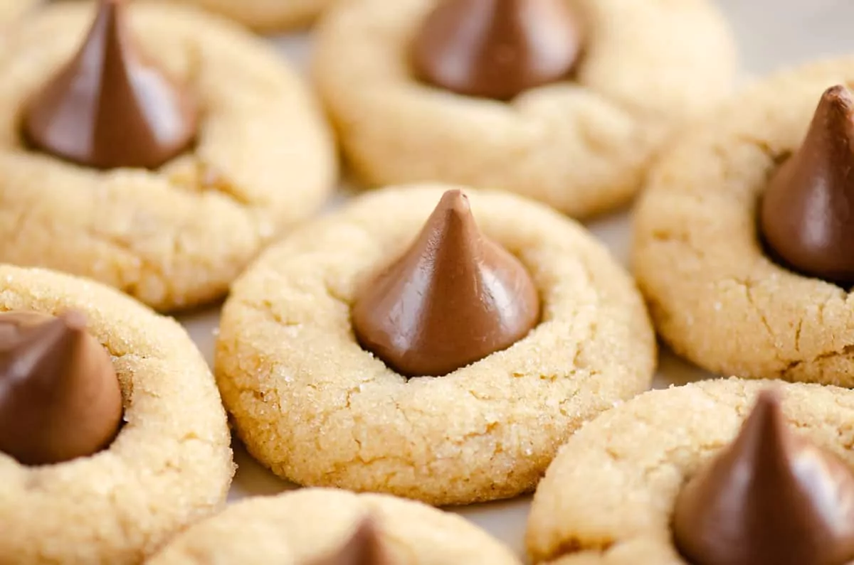 Peanut butter cookies with Hershey kisses in center.