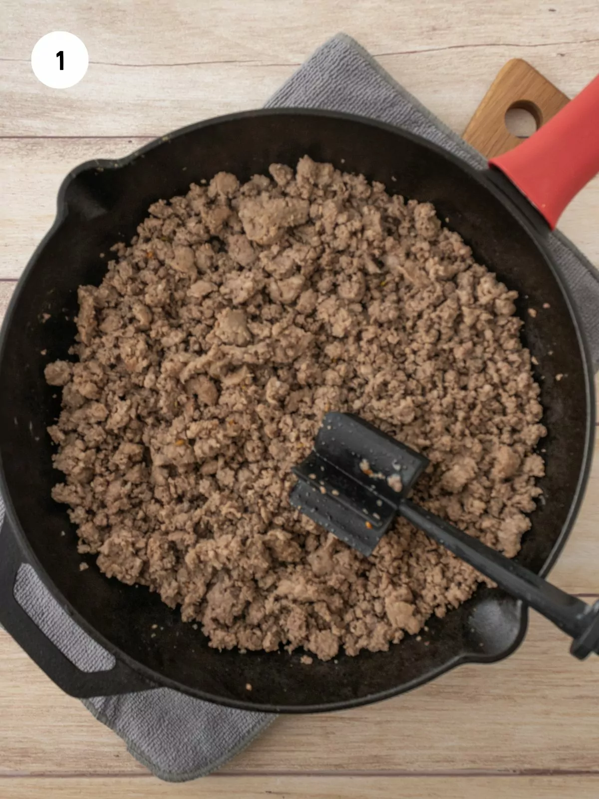 ground beef & sausage cooked in an iron skillet