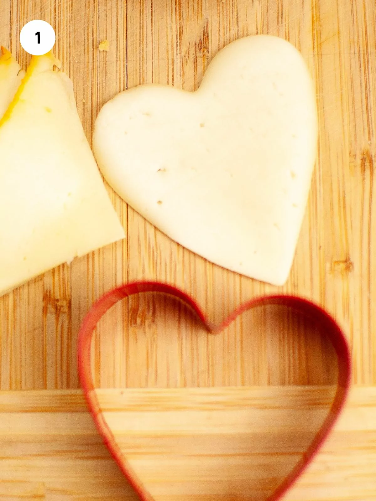 heart cookie cutter cut a slice of cheese into a heart