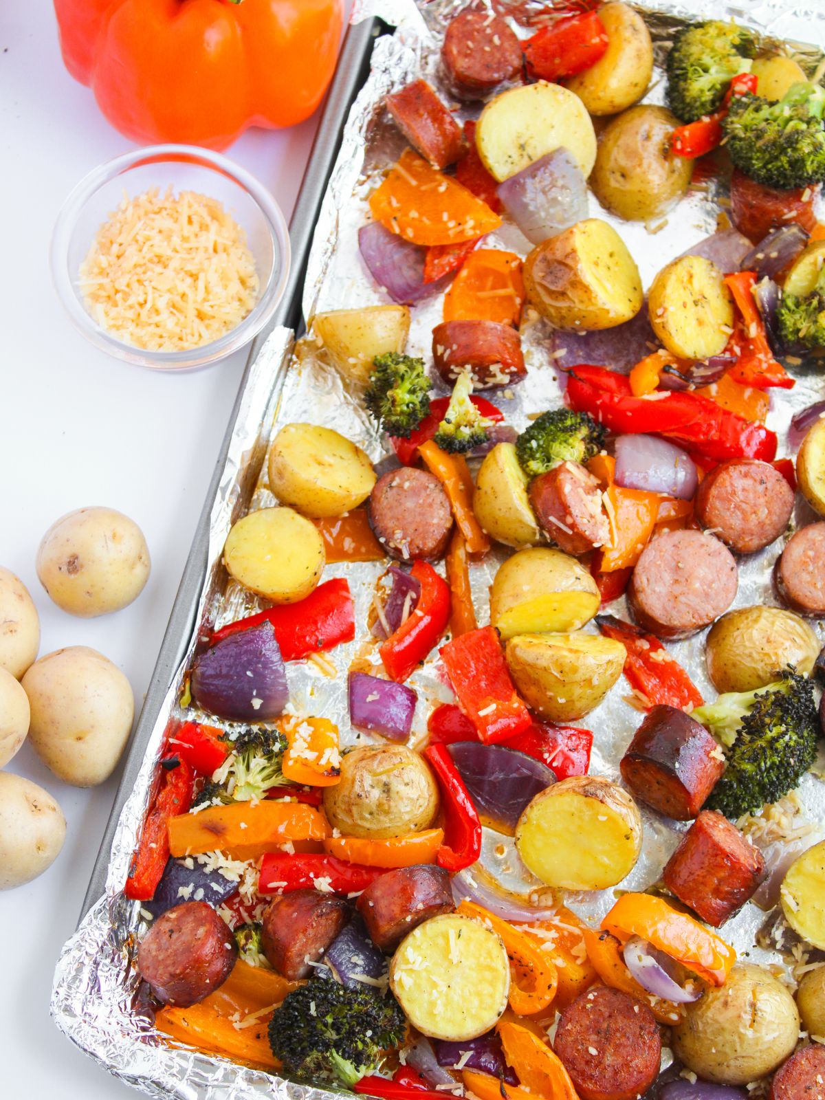 Sheet Pan filled with cooked Sausage and Vegetables