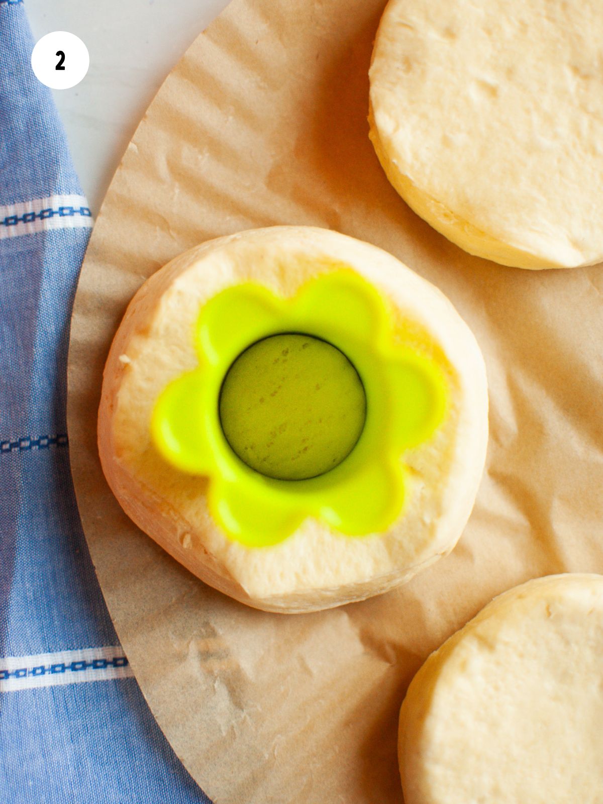 cookie cutter removing center of biscuit dough
