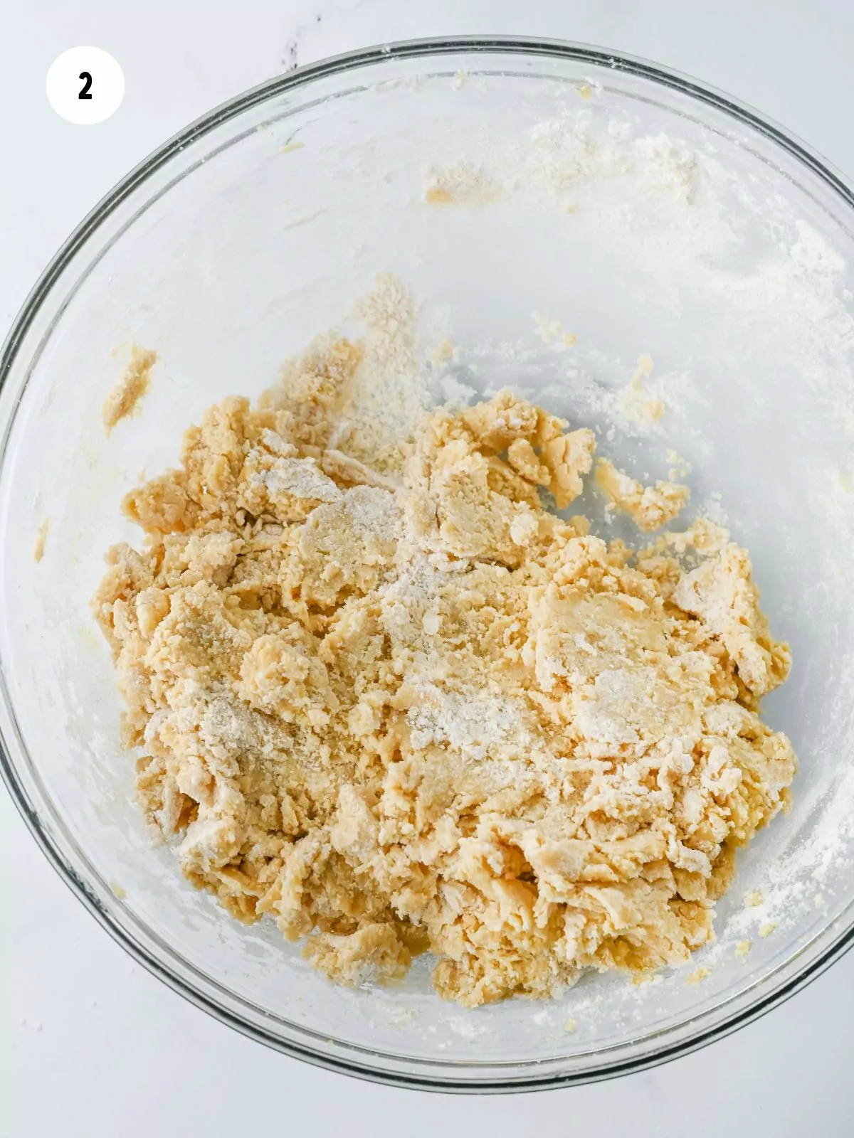 cookie dough mixed in a clear mixing bowl