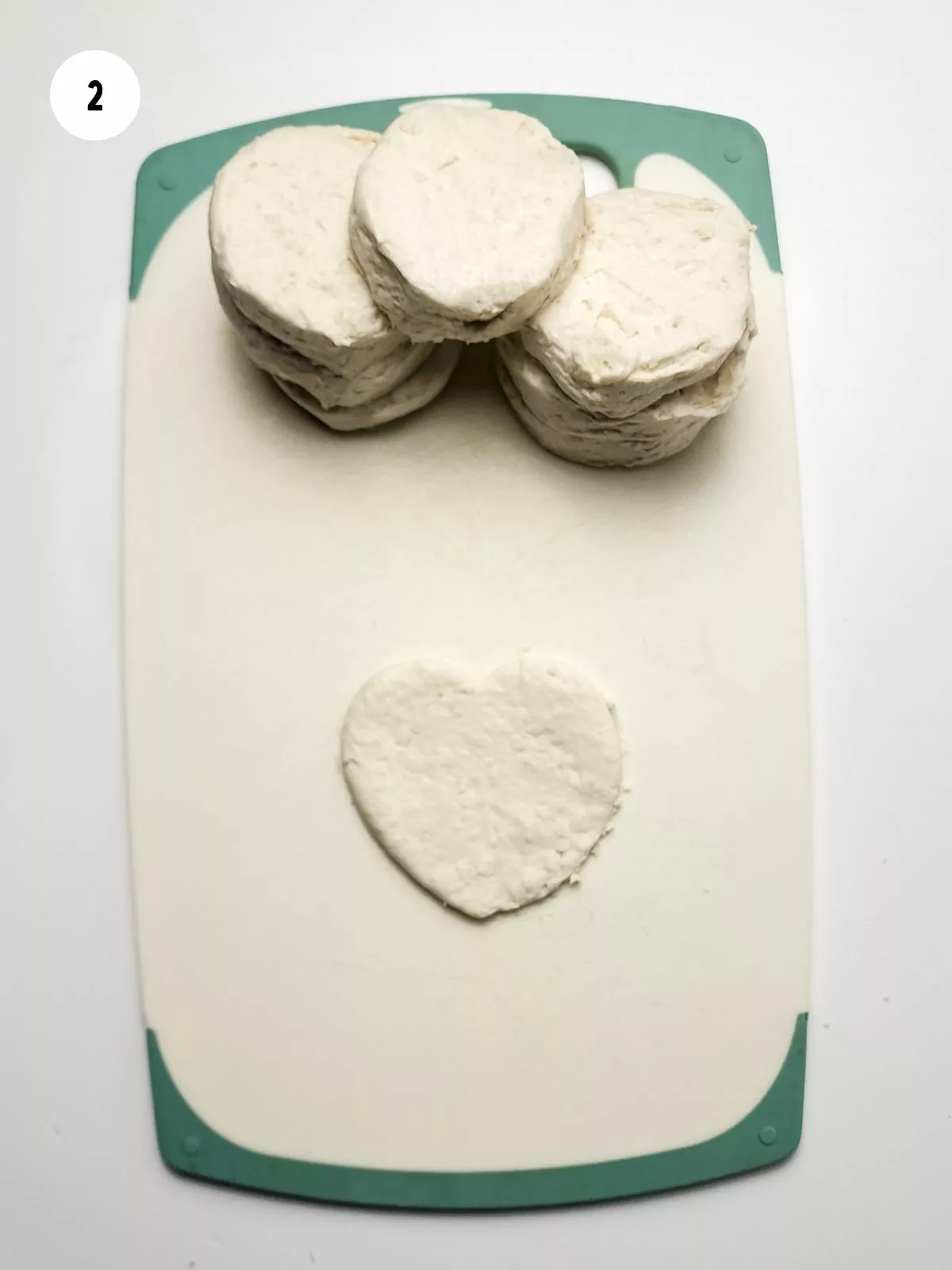 flattened biscuit dough cut into a heart