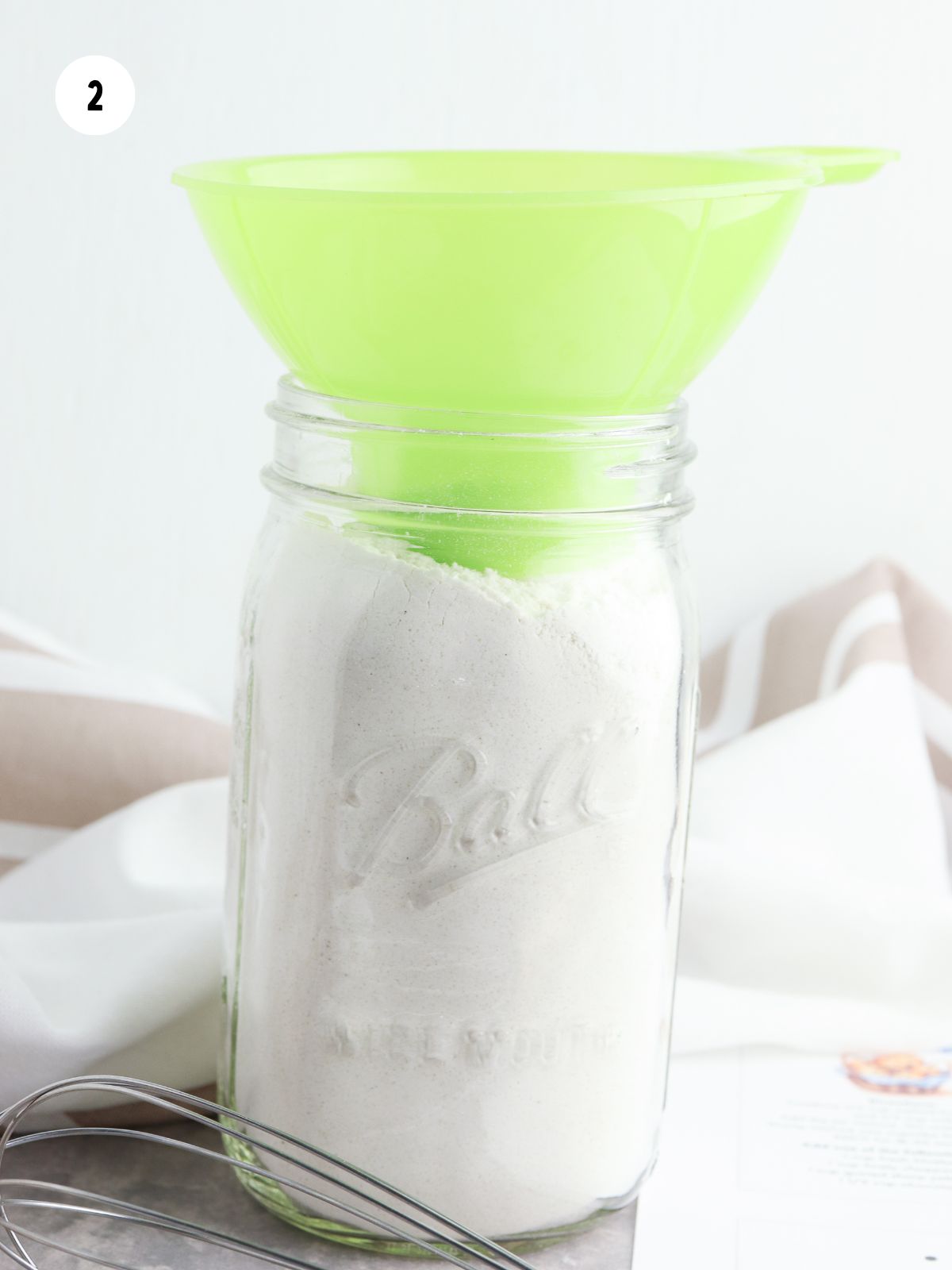 dry ingredients added to jar with a wide mouth funnel