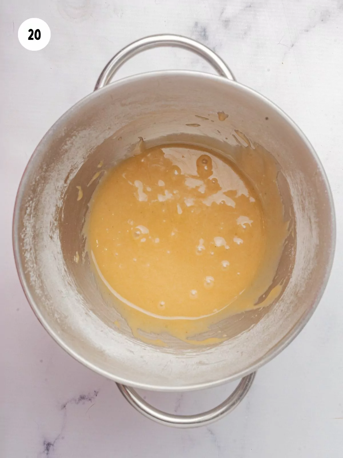 maple syrup icing in stainless steel mixer bowl