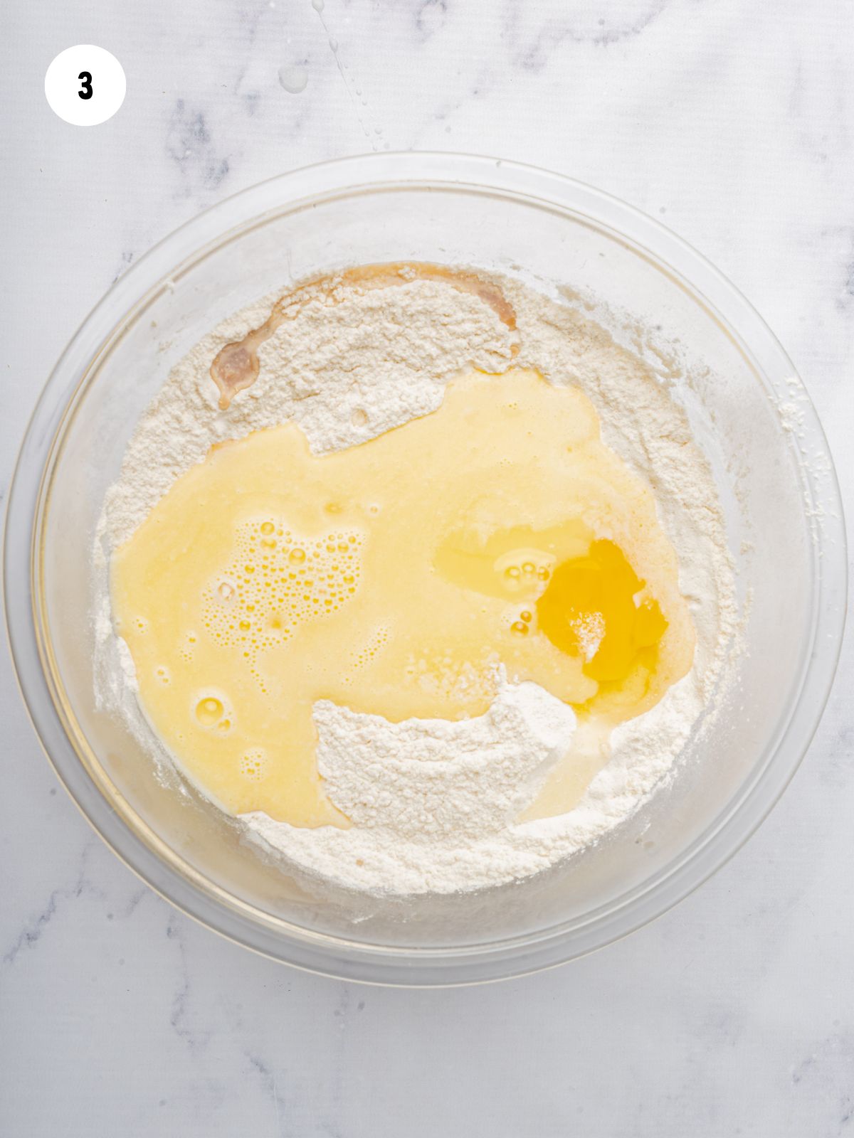 wet and dry ingredients in a clear mixing bowl