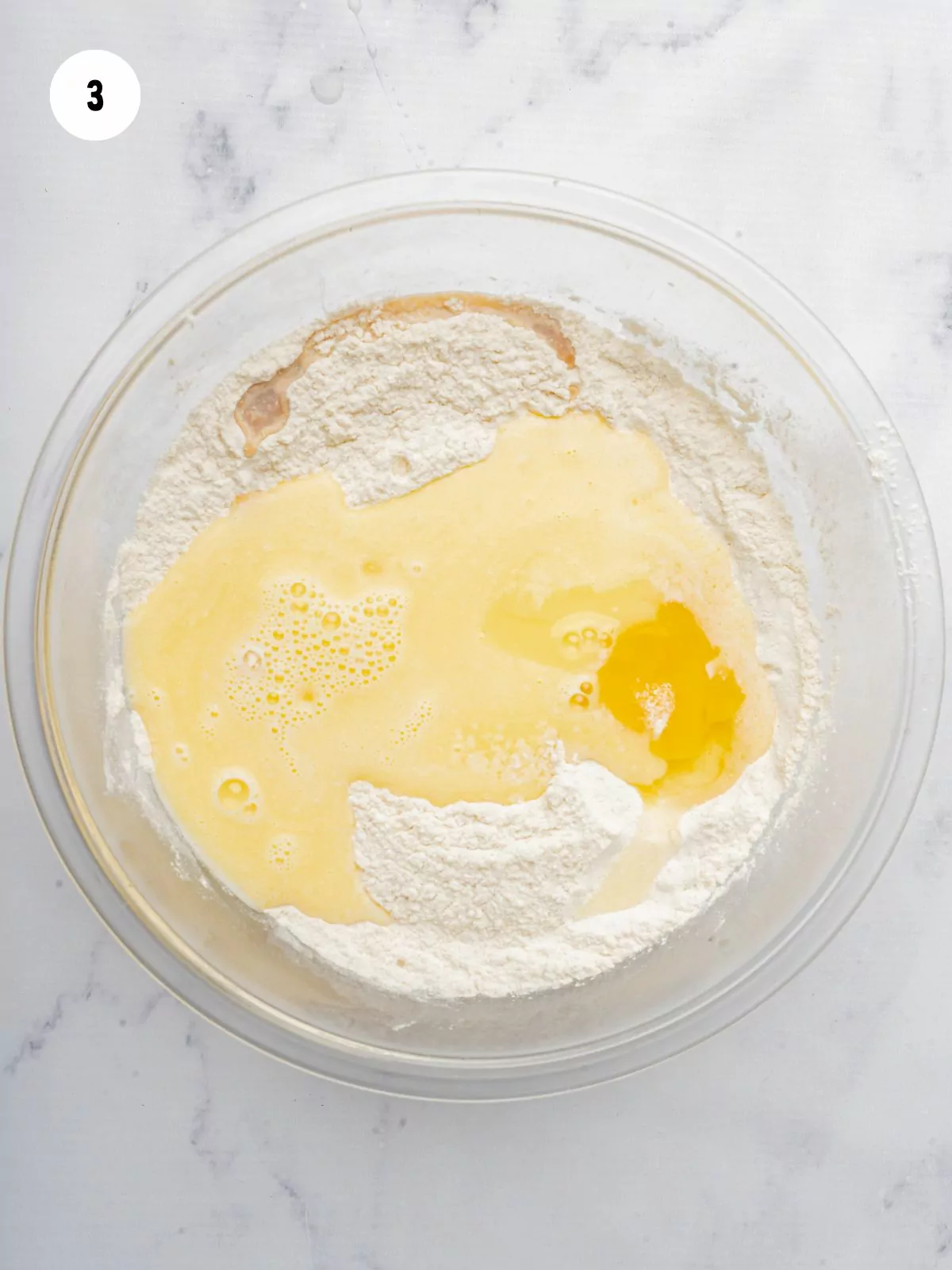 wet and dry ingredients in a clear mixing bowl