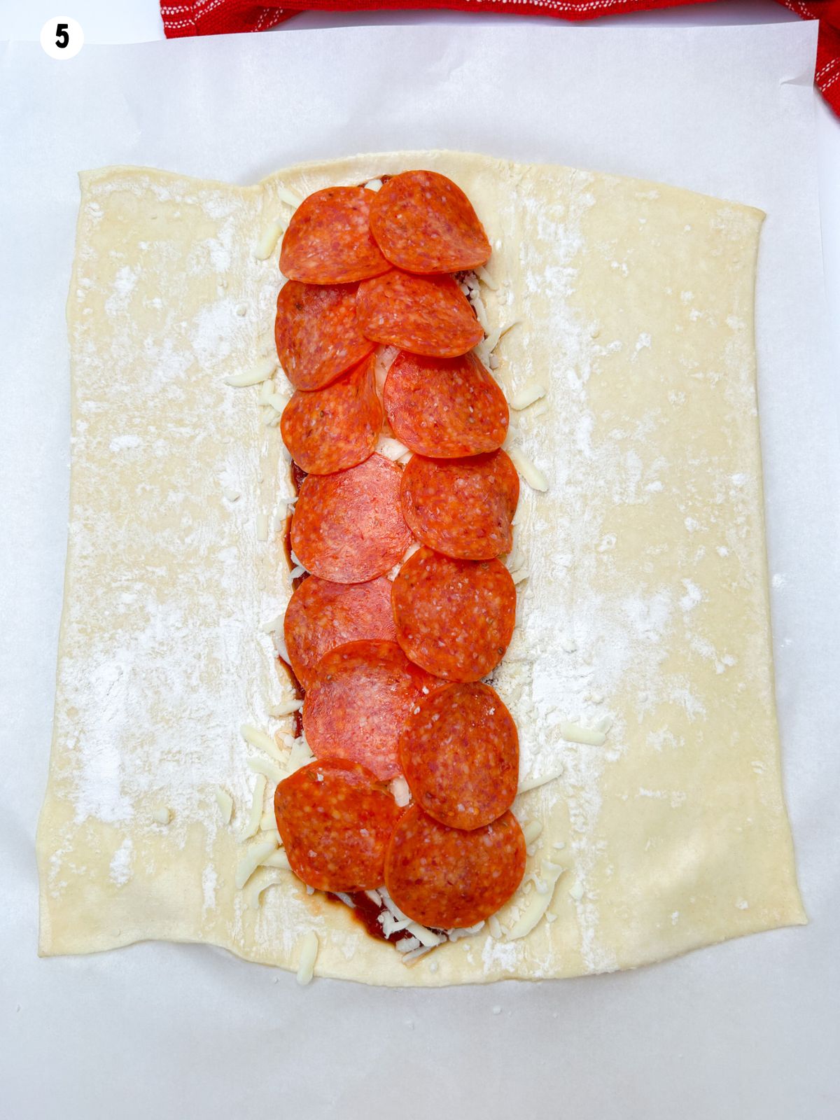 sliced pepperoni on top of the cheese.